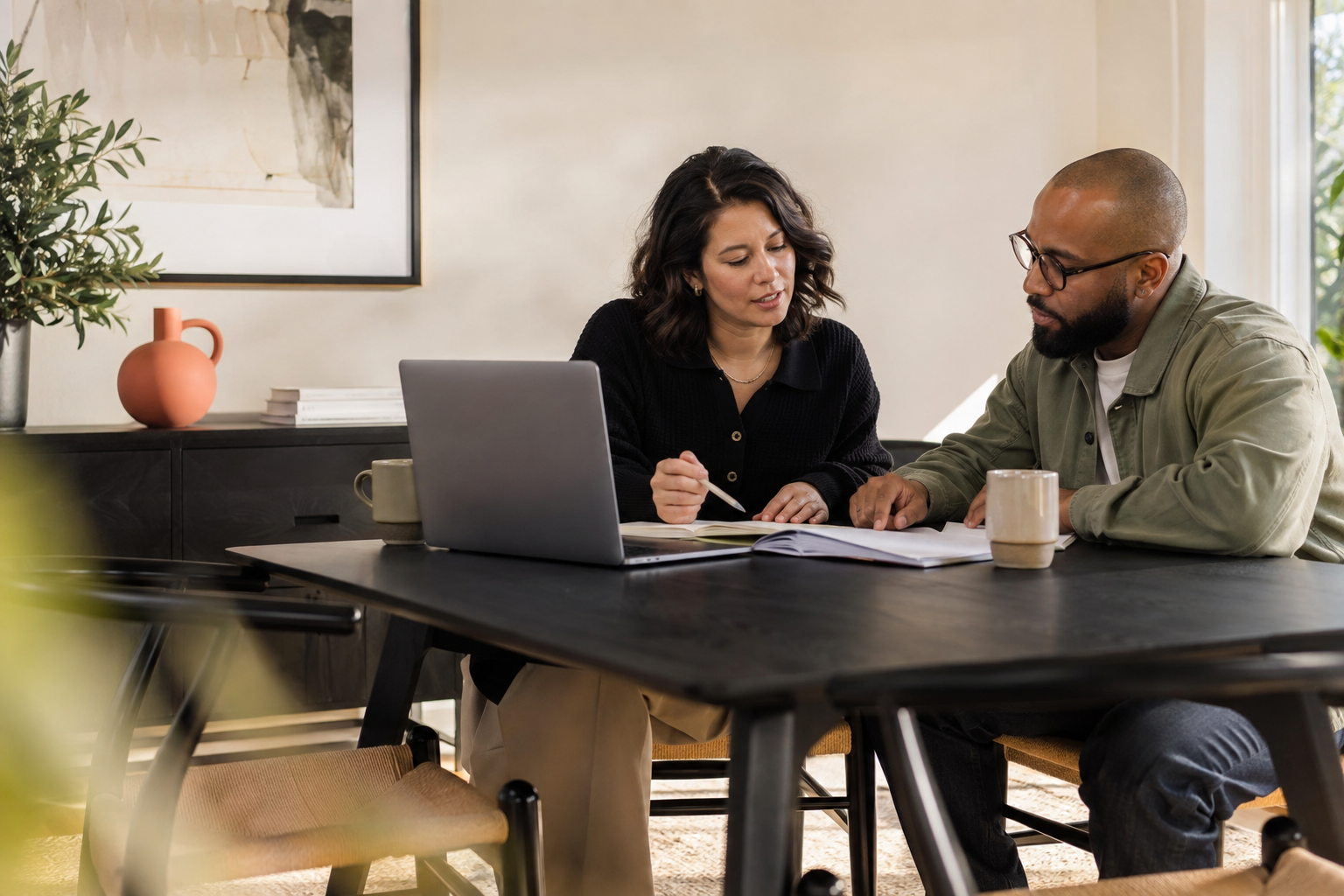 A business owner and adviser discussing the next step